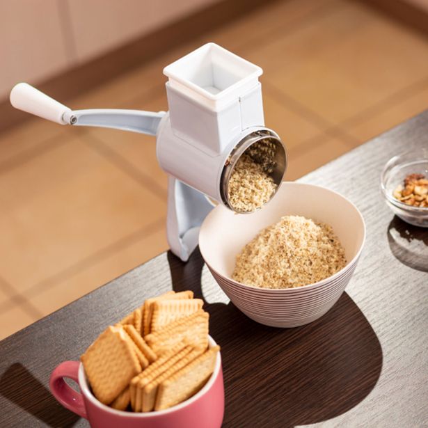 PRIPOMOČEK ZA PEKO EVA MLINČEK ZA OREHE KOVINSKI BELE BARVE