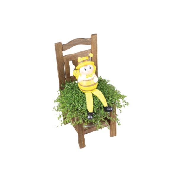 ZELENA RASTLINA DRUŽINSKA SREČA NA STOLU S ČEBELICO VELIKA NOČ